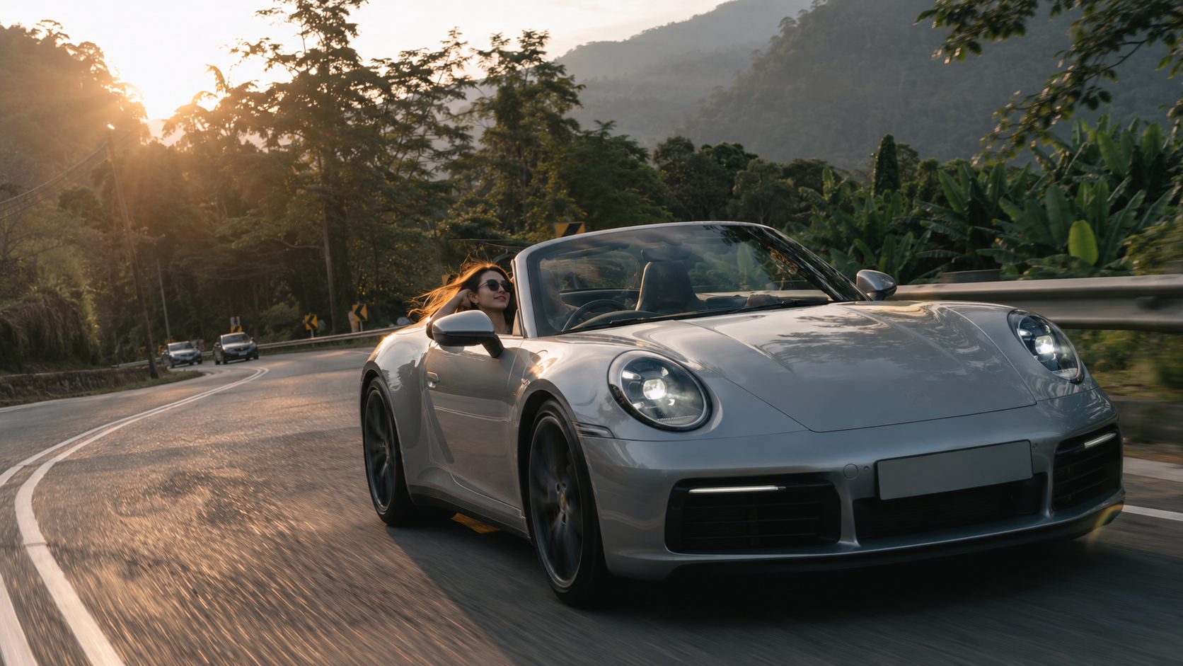 Sports car on a hill road at golden hour